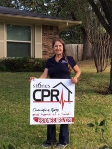 Kathlyn Smith holding yard sign for 6 Stones CPR